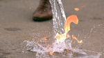 water poured on a flame